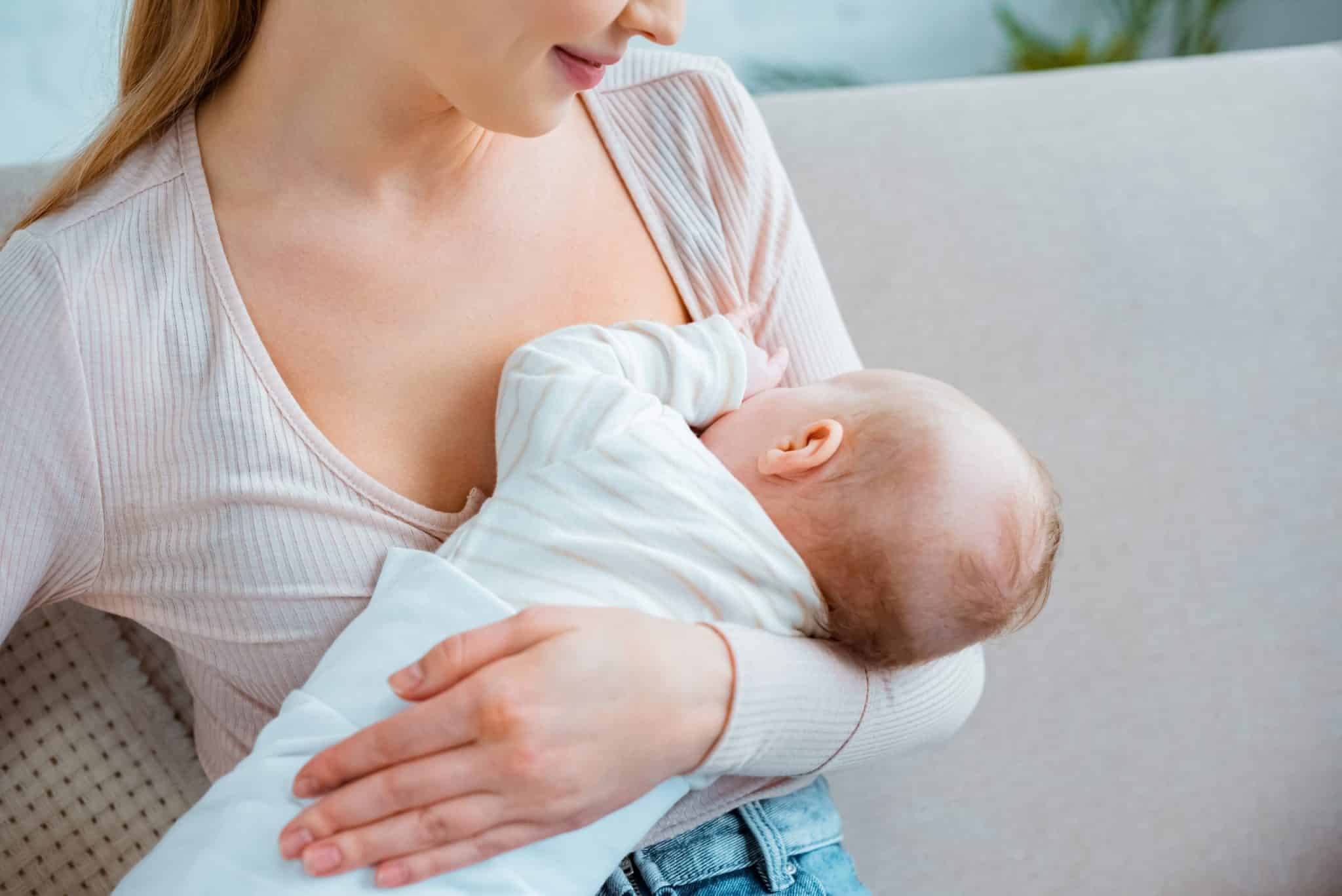 breast asymmetry after pregnancy due to breastfeeding Stock Photo